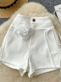 Short taille haute avec décoration rose